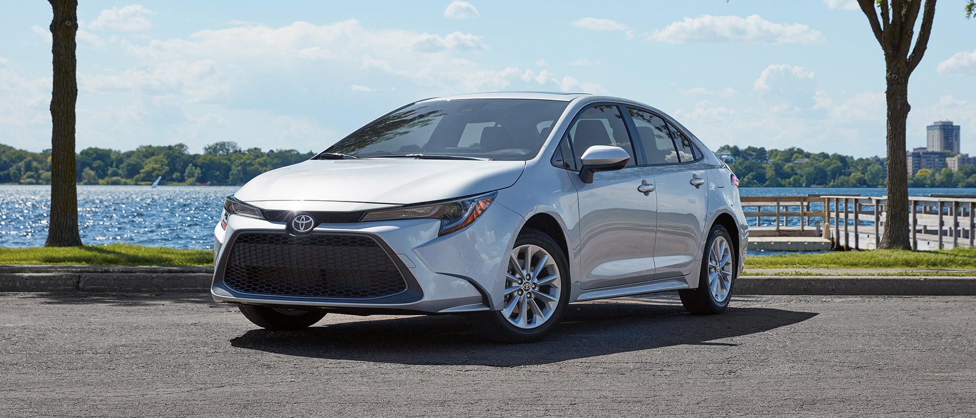 Leasing versus buying a Toyota at Fiore Toyota in Hollidaysburg | Silver MY20 Corolla Parked Lake